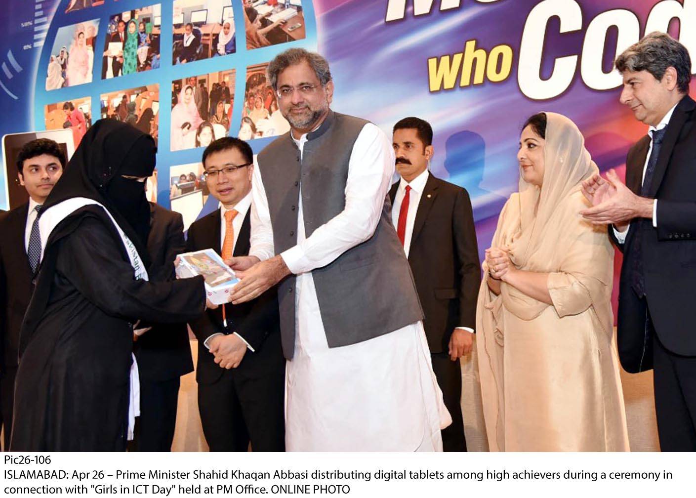 Prime Minister Shahid Khaqan Abbasi distributing digital tablets among high achievers during a ceremony in connection with “Girls in ICT Day” held at PM Office
