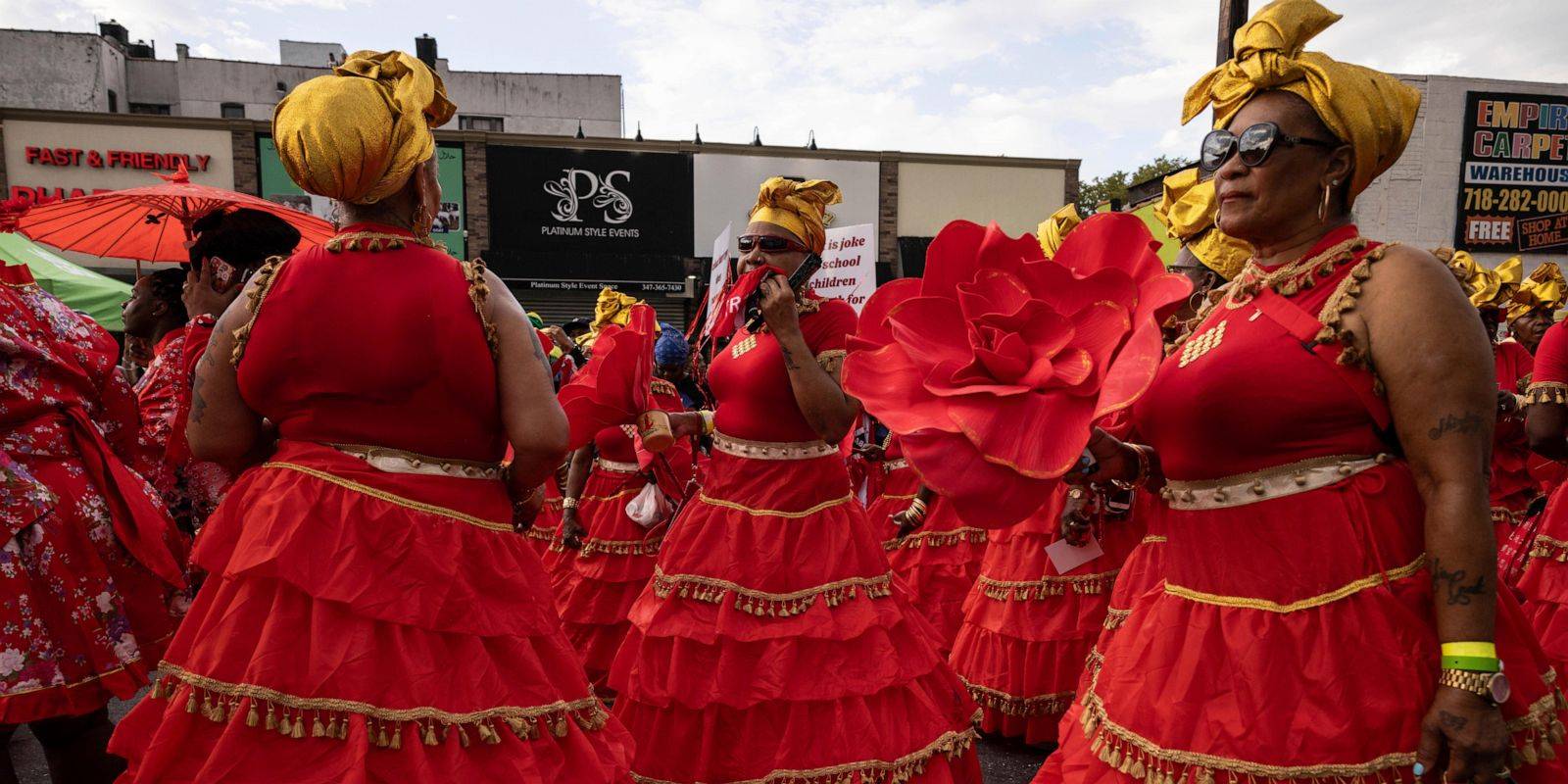 West Indian American Day Parade steps off with steel bands, colorful costumes, stilt walkers