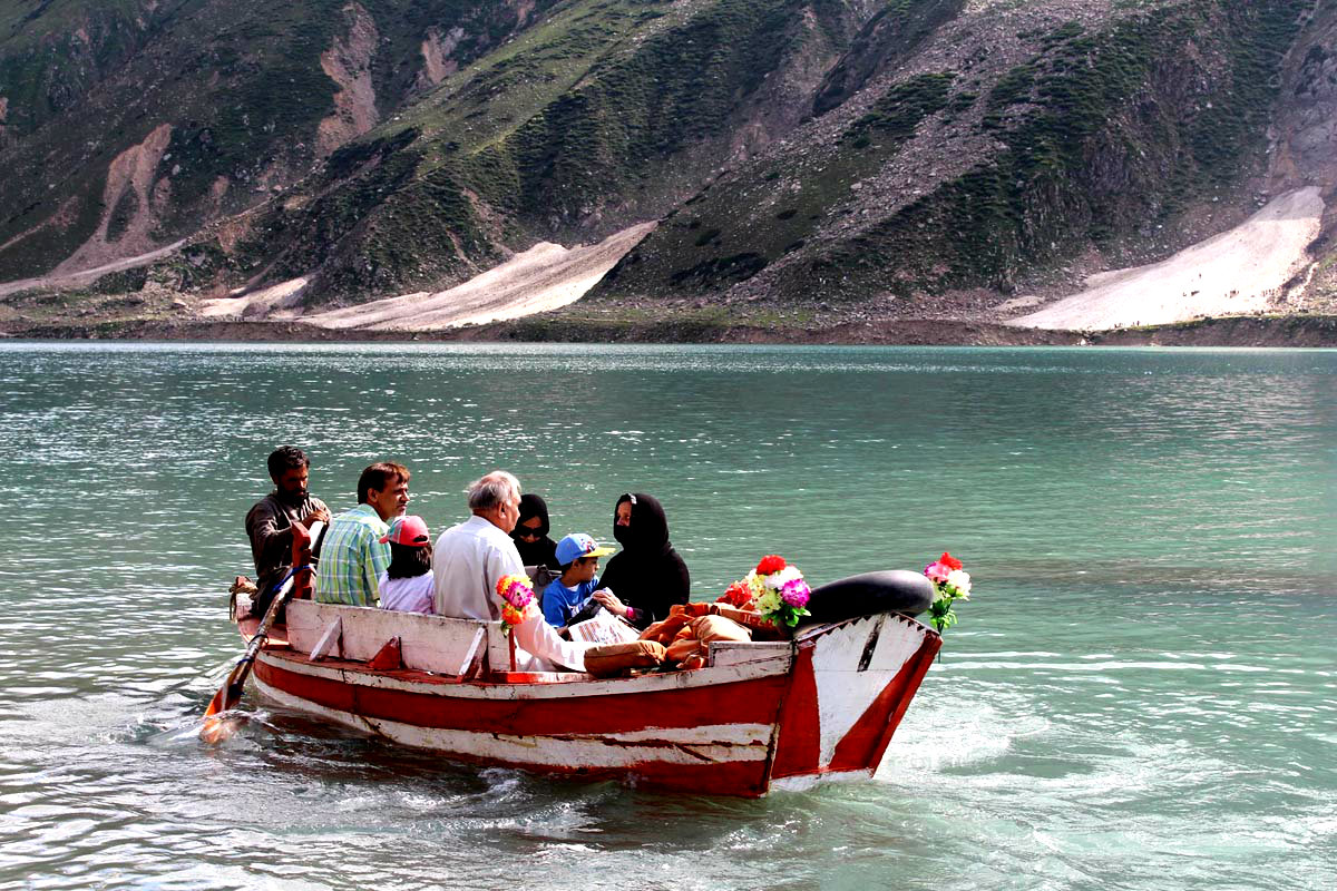 People Enjoying Boating In The Lake Saiful Maluk