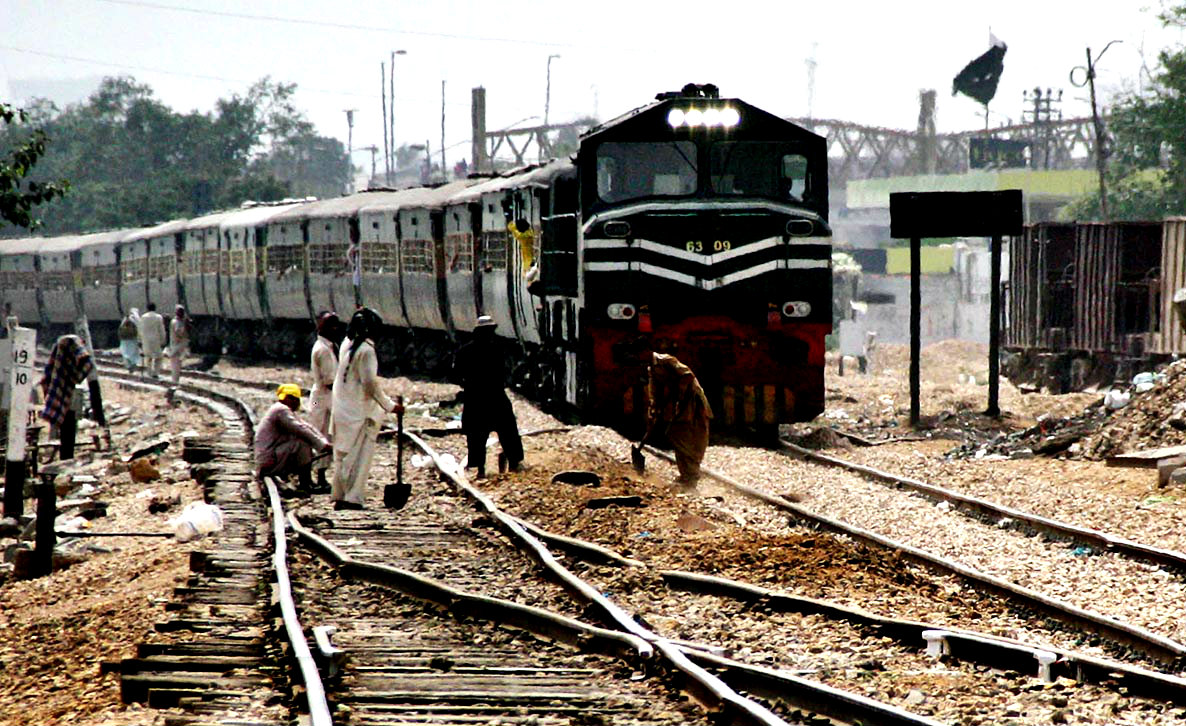 Railway Workers Seen Repairing Tracks