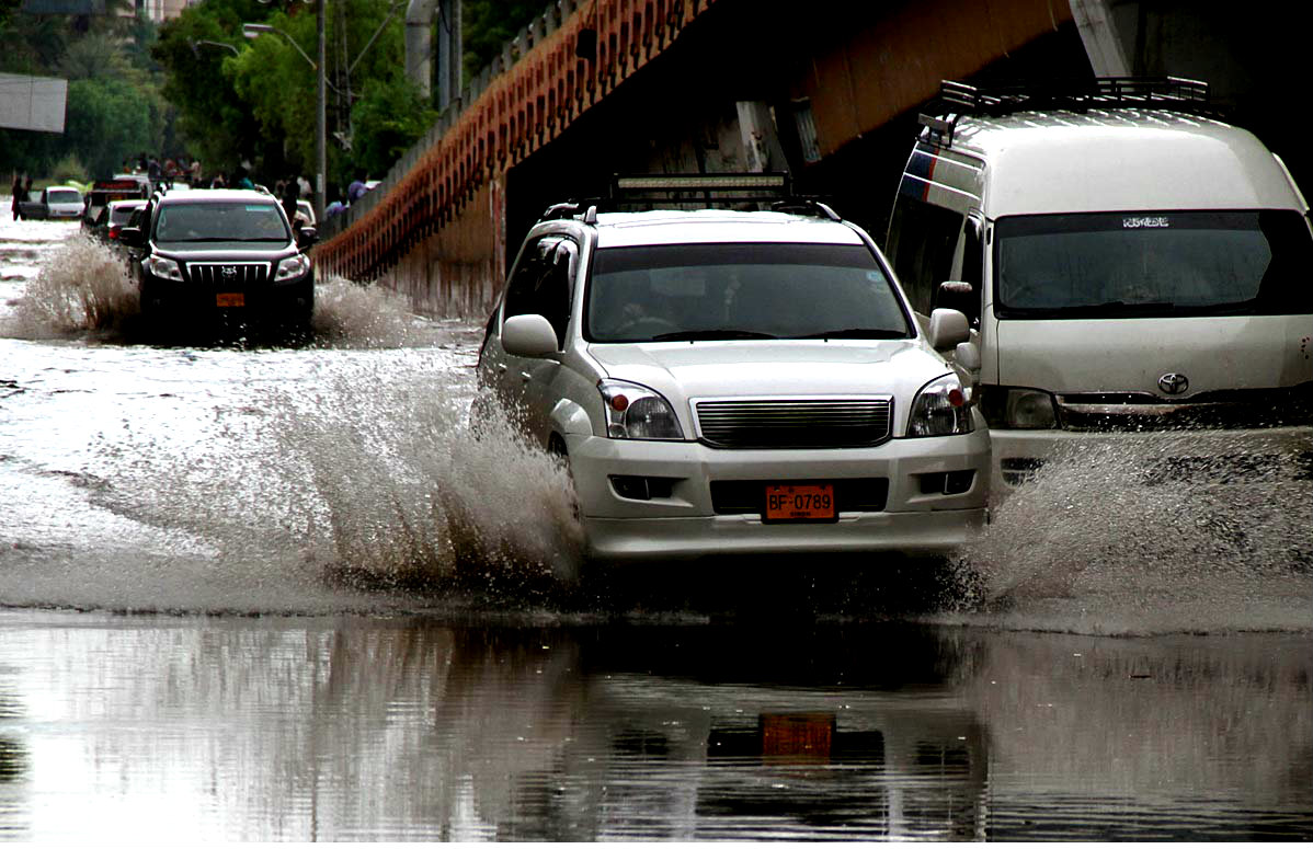Hydrabad:Vehicles Move On Road Covered With Rainwater After Heavy Monsoon
