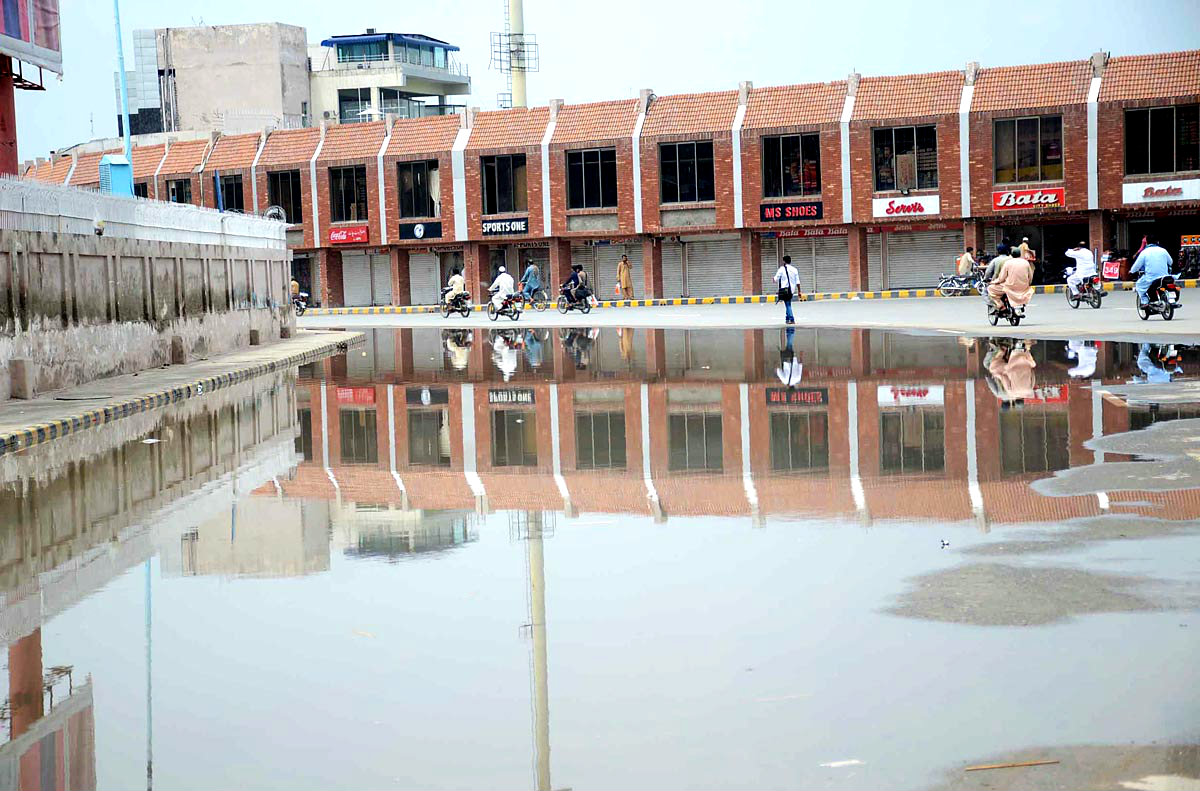 Faislabad:A View Of The Rainwater Lodged On The Road In Front Of Iqbal Stadium