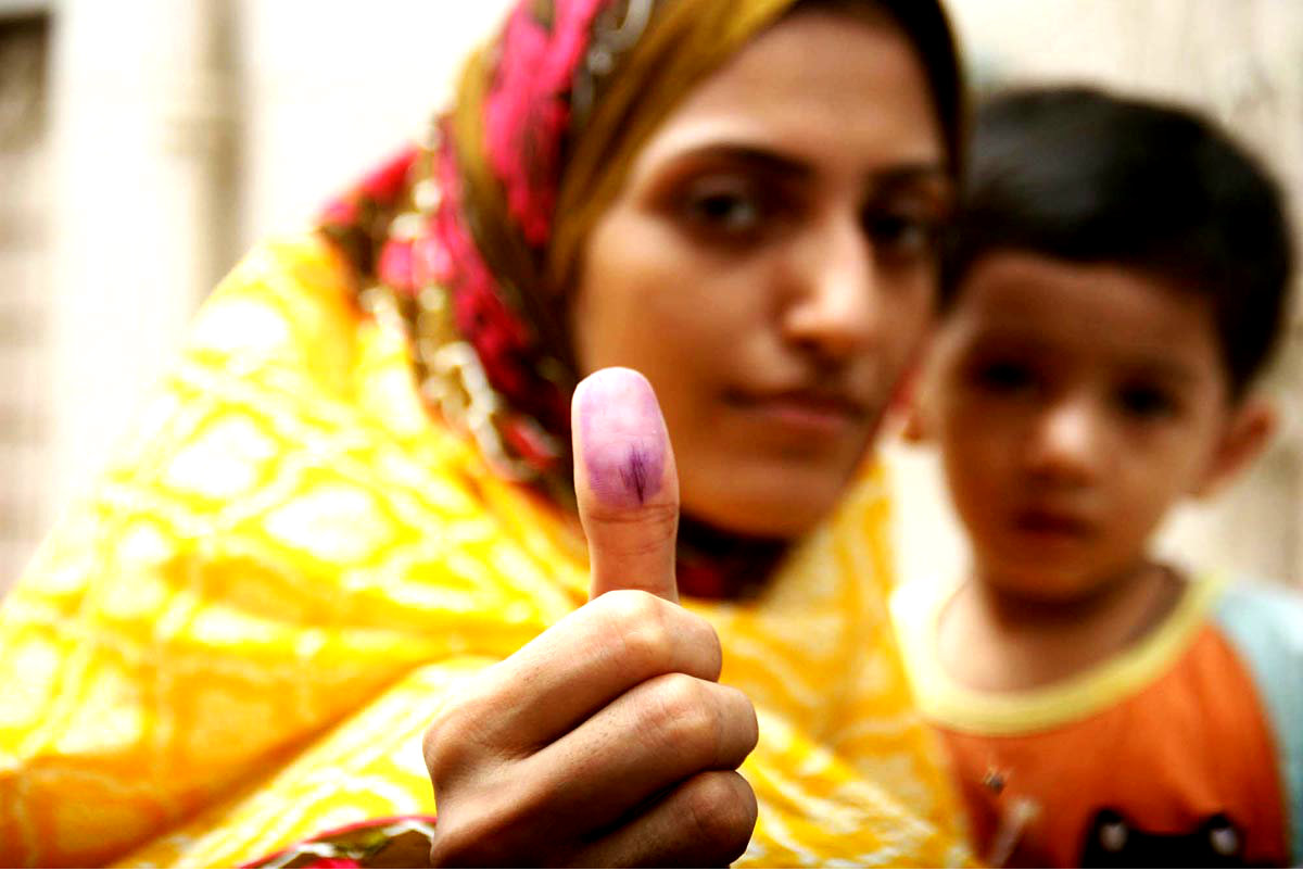 A Woman Voter Showing Her Thumb After Casting Her Vote For AJK