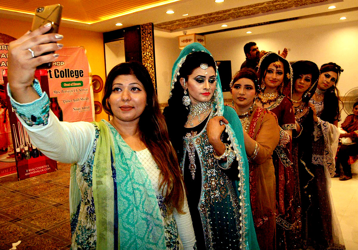 LAHORE:Models Attired In Bridal Dress Taking Selfie