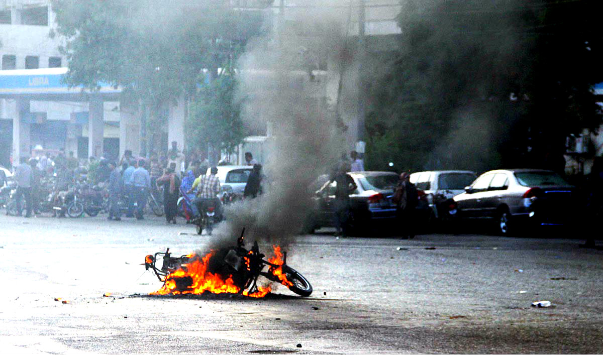 Motorcycle Set Ablaze By Angry Mob On Road Leading To Governor House